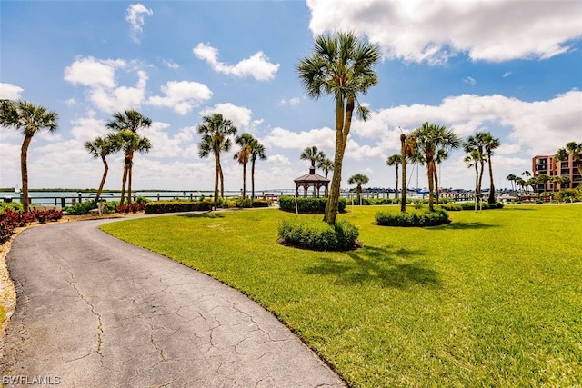 view of property's community featuring a lawn and a gazebo