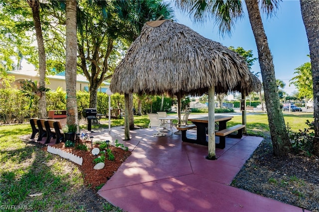 view of home's community with a patio area