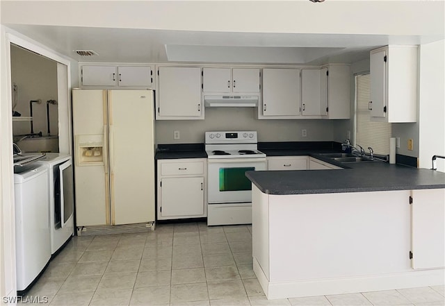 kitchen featuring light tile flooring, separate washer and dryer, white appliances, and sink