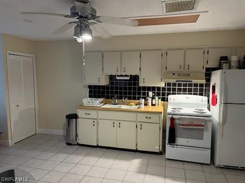 kitchen with sink, backsplash, light tile patterned floors, ceiling fan, and white appliances