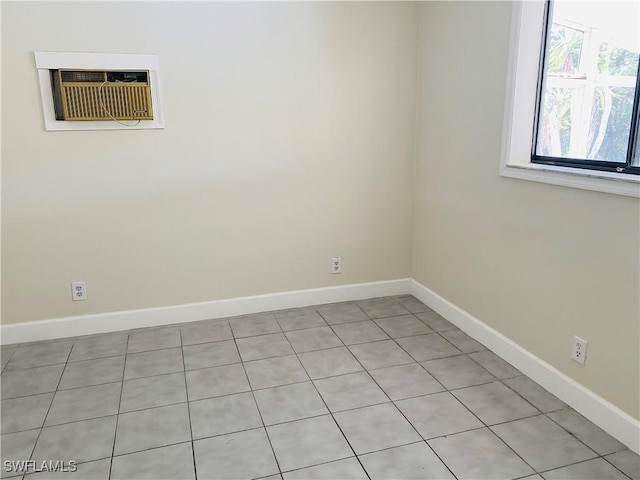 spare room featuring an AC wall unit