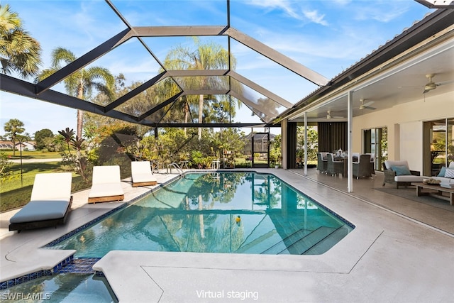 view of swimming pool with a patio area, a lanai, ceiling fan, and an outdoor hangout area