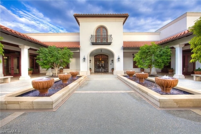 entrance to property featuring a balcony