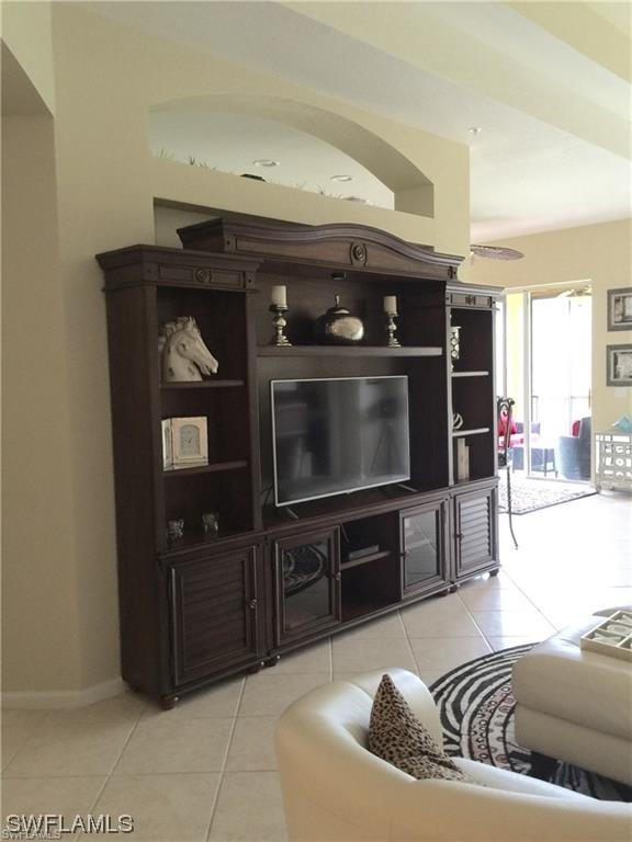 living room featuring light tile patterned flooring