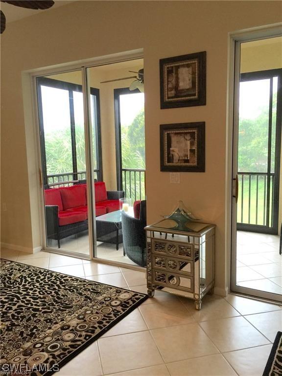 doorway to outside featuring tile patterned floors and ceiling fan