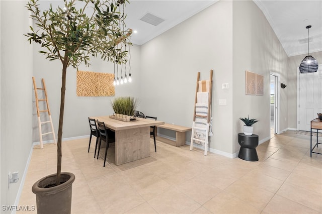 tiled dining room featuring crown molding