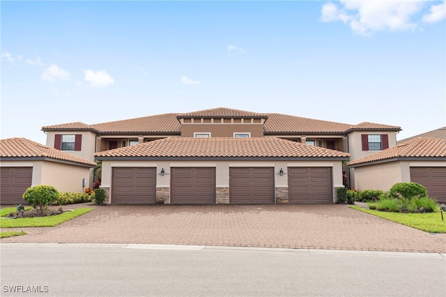 mediterranean / spanish house featuring a garage