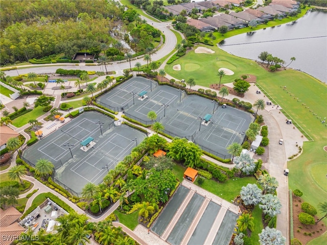 birds eye view of property with a water view