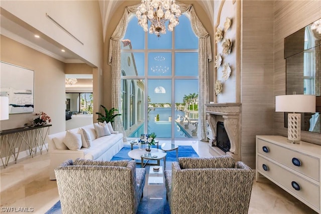 living room with a chandelier and a high ceiling