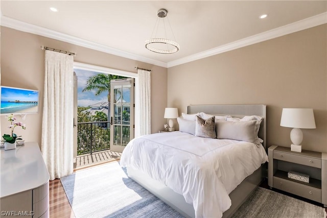 bedroom with hardwood / wood-style floors, access to outside, and ornamental molding