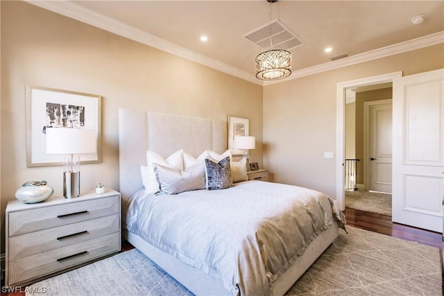 bedroom featuring crown molding, a notable chandelier, and wood-type flooring