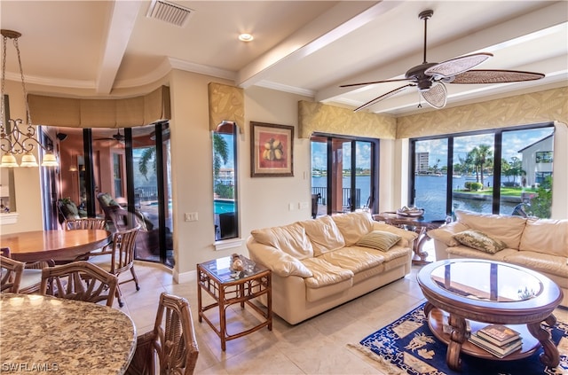 tiled living room with ornamental molding, beamed ceiling, a water view, and ceiling fan