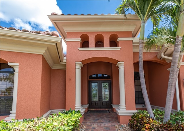 property entrance featuring french doors