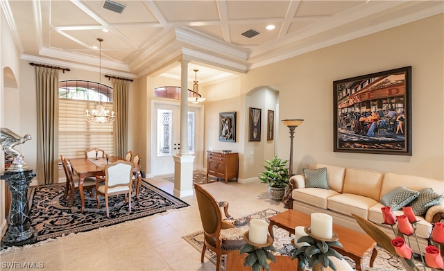 tiled living room featuring an inviting chandelier, beamed ceiling, ornate columns, crown molding, and coffered ceiling