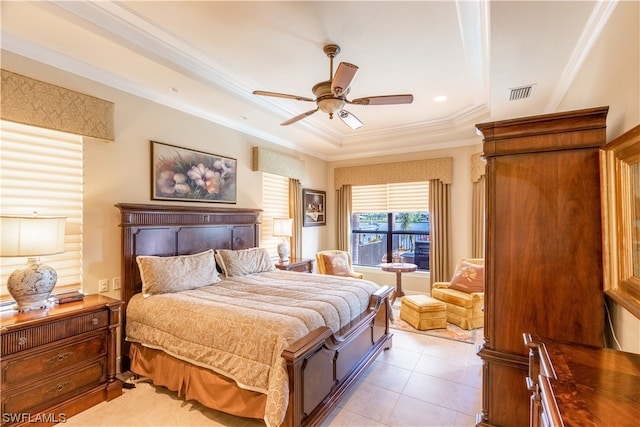 tiled bedroom with ceiling fan, crown molding, and a tray ceiling