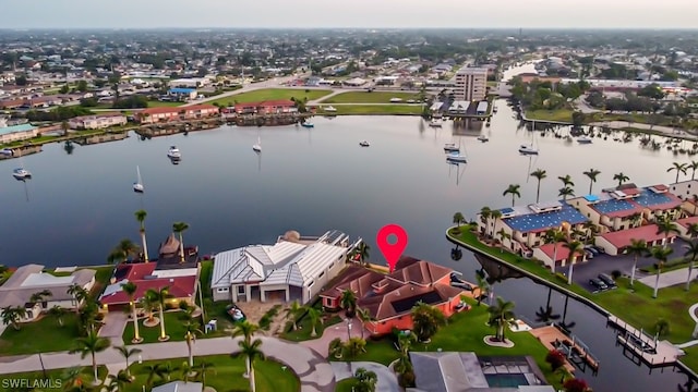 birds eye view of property with a water view