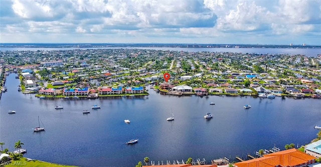 birds eye view of property with a water view