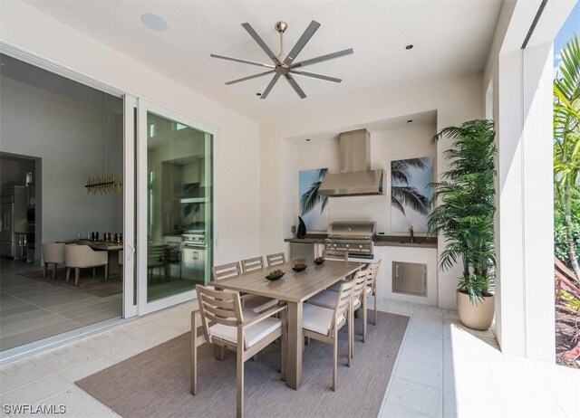 view of patio featuring ceiling fan, an outdoor kitchen, sink, and a grill