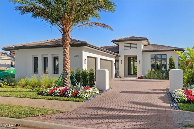 view of front of property with a garage