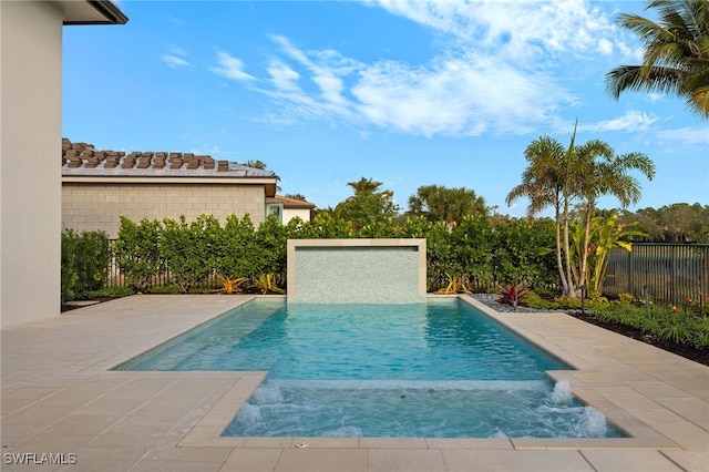 view of pool featuring a patio