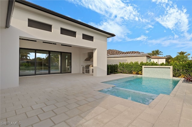 view of swimming pool featuring area for grilling, grilling area, and a patio area