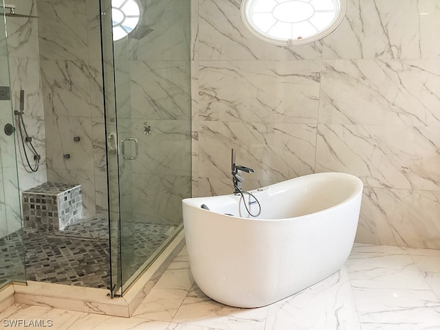 bathroom with tile walls, plus walk in shower, and tile flooring