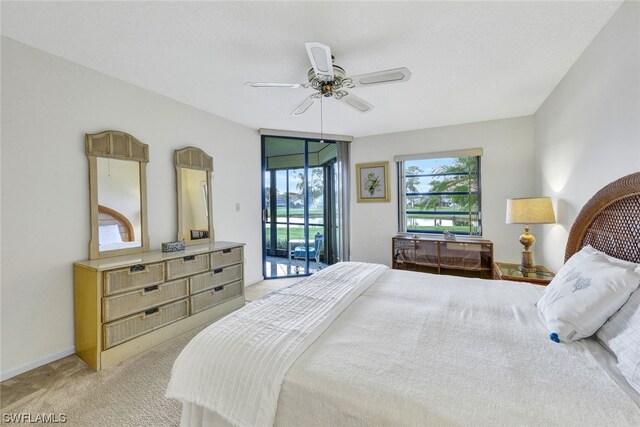 carpeted bedroom with access to outside and ceiling fan