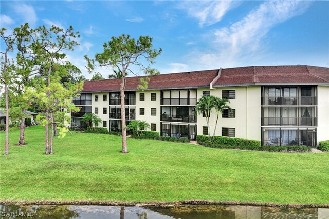 view of building exterior with a water view