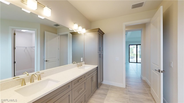 bathroom with vanity and tile patterned floors