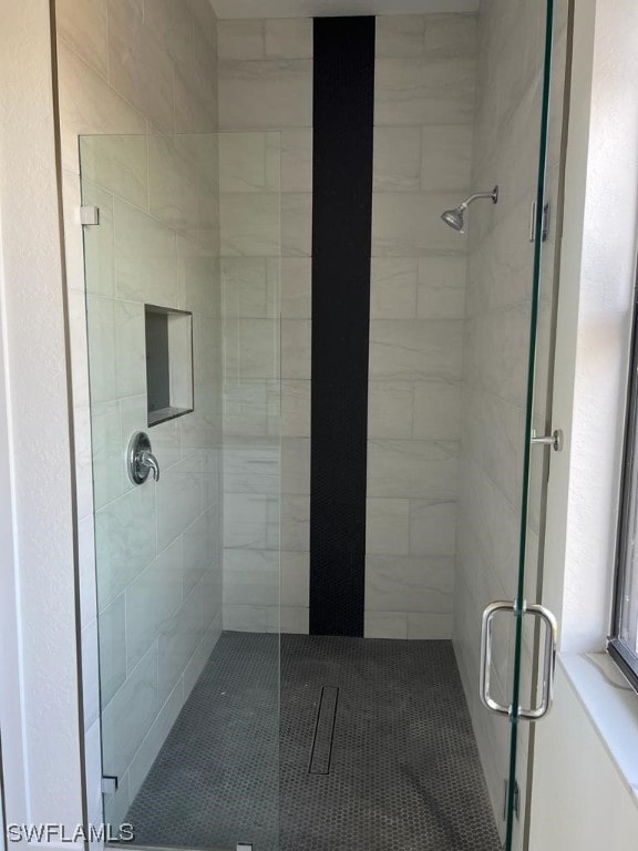 bathroom featuring an enclosed shower