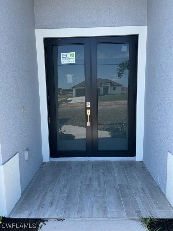 doorway to property featuring french doors