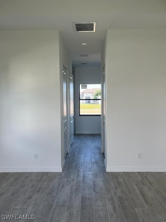 hall with dark wood-type flooring