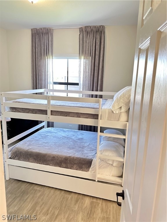 bedroom featuring wood-type flooring