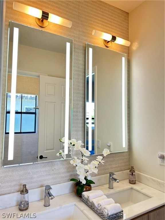 bathroom featuring vanity with extensive cabinet space