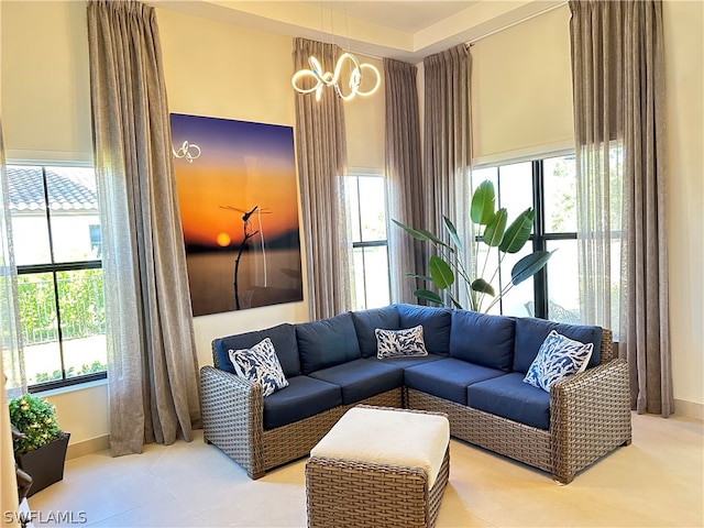 living room featuring a notable chandelier