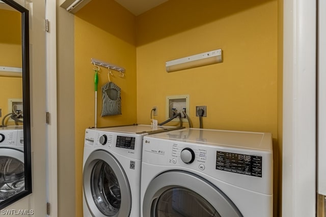 washroom with washing machine and dryer