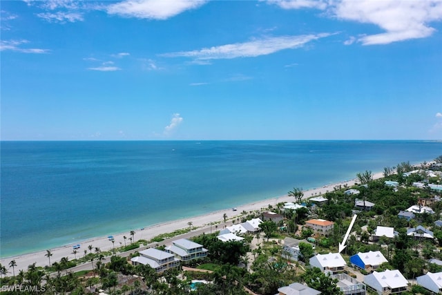 birds eye view of property featuring a view of the beach and a water view