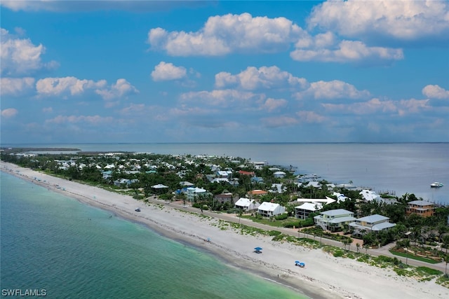 drone / aerial view with a water view and a view of the beach