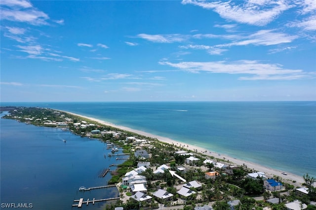 bird's eye view featuring a water view and a view of the beach