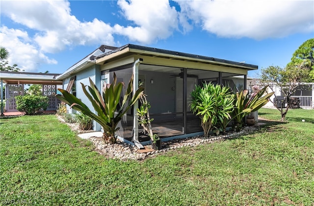 view of home's exterior featuring a lawn