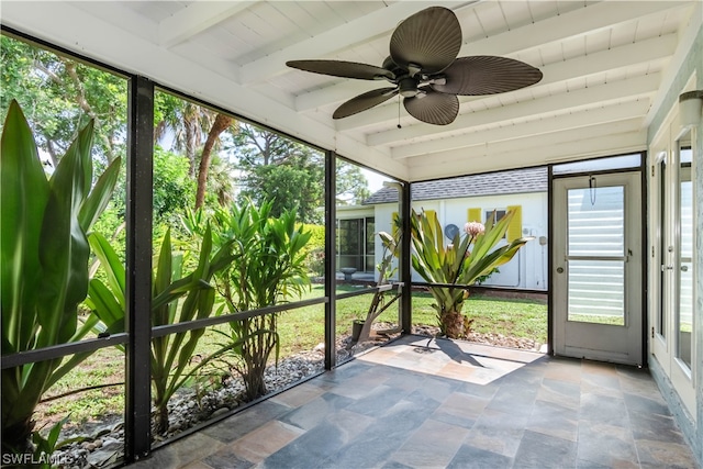 unfurnished sunroom with beam ceiling and ceiling fan