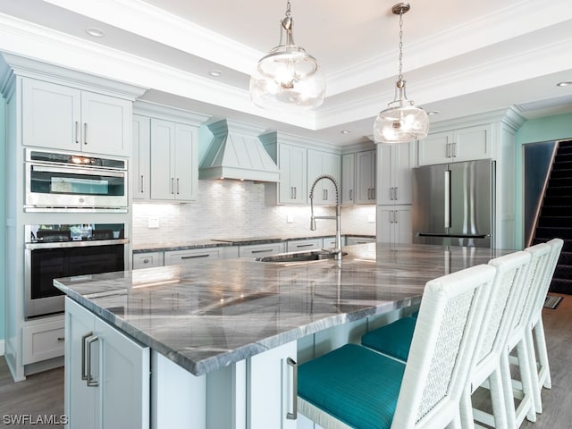 kitchen featuring custom range hood, dark hardwood / wood-style floors, tasteful backsplash, and stainless steel appliances