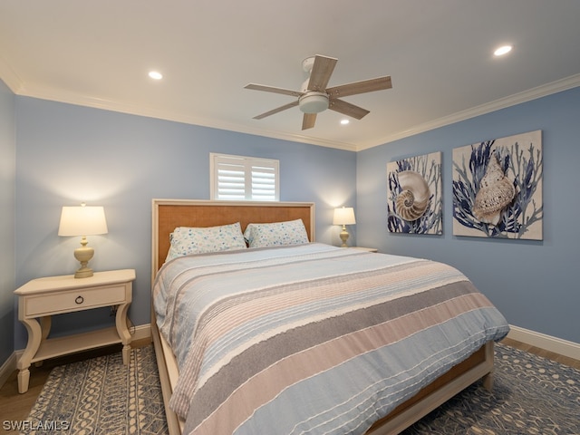 bedroom featuring dark wood-type flooring, ornamental molding, and ceiling fan