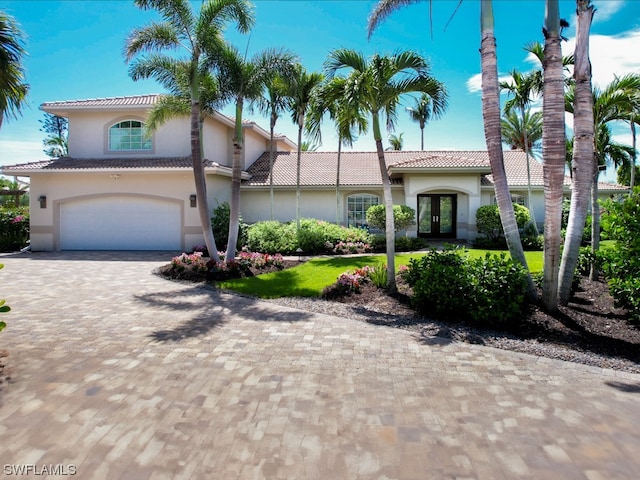 mediterranean / spanish-style house featuring a garage