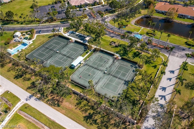 birds eye view of property with a water view