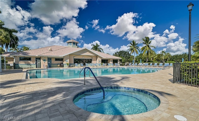 view of pool with a community hot tub