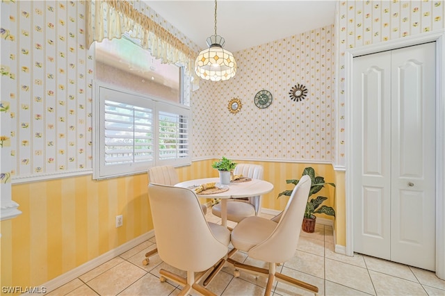 dining area featuring light tile floors