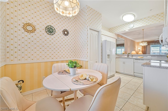 tiled dining space with crown molding