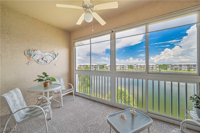 sunroom / solarium with ceiling fan