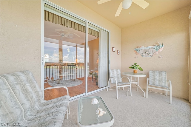 sunroom / solarium featuring ceiling fan